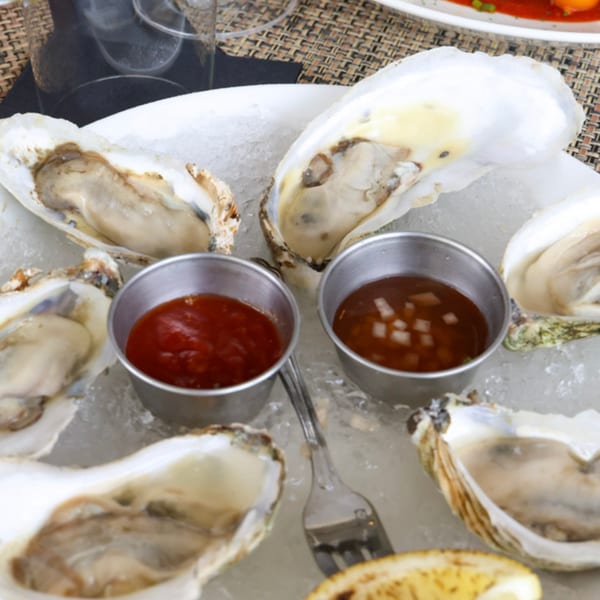 Fresh oysters on the half shell, served on ice with cocktail sauce and mignonette at Waypoint Seafood & Grill.